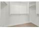 Bright, open walk-in closet with multiple shelves and carpeted floor at 3851 E San Pedro Ave, Gilbert, AZ 85234
