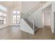 Bright entryway with staircase, high ceilings, wood floors, and modern chandelier at 3851 E San Pedro Ave, Gilbert, AZ 85234