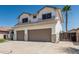 Two-story home features a two-car garage, green lawn, desert landscaping, and a palm tree at 3851 E San Pedro Ave, Gilbert, AZ 85234
