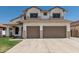 Two-story home features a two-car garage, green lawn, and desert landscaping at 3851 E San Pedro Ave, Gilbert, AZ 85234