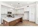Updated kitchen boasts white cabinets, quartz countertops, and stainless steel appliances at 3851 E San Pedro Ave, Gilbert, AZ 85234