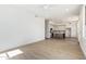 Bright open-concept living room and kitchen features hardwood floors and modern fixtures at 3851 E San Pedro Ave, Gilbert, AZ 85234