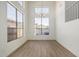 Living room featuring hardwood floors, high ceilings, and clerestory windows to maximize sunlight at 3851 E San Pedro Ave, Gilbert, AZ 85234