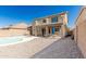 Backyard with large pool, shaded patio and a spacious gravel area perfect for entertaining at 3910 W Goldmine Mountain Dr, San Tan Valley, AZ 85144