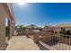 Balcony with metal railing offers serene views of the neighborhood and distant mountains at 3910 W Goldmine Mountain Dr, San Tan Valley, AZ 85144