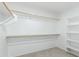 This walk-in closet includes rods and shelving at 3910 W Goldmine Mountain Dr, San Tan Valley, AZ 85144