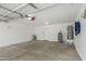 Spacious garage with high ceilings, concrete floor, and ample room for vehicles and storage at 3910 W Goldmine Mountain Dr, San Tan Valley, AZ 85144