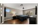 Comfortable bedroom with a large bed, round window, and treadmill at 4043 E Mountain Vista Dr, Phoenix, AZ 85048