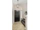 Welcoming entryway showcases a modern light fixture, tile flooring, and staircase leading to the upper level at 4043 E Mountain Vista Dr, Phoenix, AZ 85048