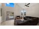 Cozy living room showcasing a fireplace, inviting seating, and sliding door access to the pool at 4043 E Mountain Vista Dr, Phoenix, AZ 85048