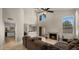 Inviting living room features high ceilings, a cozy fireplace, and seamless access to outdoor living at 4043 E Mountain Vista Dr, Phoenix, AZ 85048