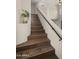 Elegant staircase with dark wood steps and a contrasting white and black railing at 4043 E Mountain Vista Dr, Phoenix, AZ 85048