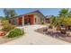 Outdoor patio and desert-style landscaping create a low-maintenance backyard retreat at 42022 W Cheyenne Dr, Maricopa, AZ 85138