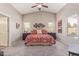 Spacious bedroom featuring vaulted ceilings, ample lighting, and modern decor at 42022 W Cheyenne Dr, Maricopa, AZ 85138