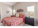 Cozy bedroom with modern decor, carpet flooring, and natural light at 42022 W Cheyenne Dr, Maricopa, AZ 85138