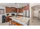 Beautiful kitchen island featuring granite countertops, cabinetry, and stainless steel appliances at 42022 W Cheyenne Dr, Maricopa, AZ 85138