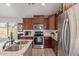 Well-appointed kitchen with stainless steel appliances and ample cabinet space at 42022 W Cheyenne Dr, Maricopa, AZ 85138