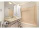 Bathroom featuring a vanity sink and shower-tub combination with a shower curtain at 4648 N 40Th St, Phoenix, AZ 85018