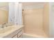 Bathroom with a well-lit shower-tub combination and a modern vanity sink at 4648 N 40Th St, Phoenix, AZ 85018
