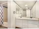 Bathroom with dual sinks, vanity, a large mirror, and a shower/tub combination at 4648 N 40Th St, Phoenix, AZ 85018
