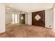 Bedroom with large mirrored closet doors and wood-accent wall adding character at 4648 N 40Th St, Phoenix, AZ 85018