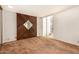 Cozy bedroom showcasing a wood-accent wall, natural light, and outdoor views at 4648 N 40Th St, Phoenix, AZ 85018