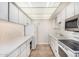 Efficient galley kitchen with ample storage, white cabinetry, and essential appliances at 4648 N 40Th St, Phoenix, AZ 85018