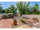 A charming outdoor space featuring a patio seating area surrounded by lush landscaping and privacy walls at 4648 N 40Th St, Phoenix, AZ 85018
