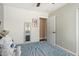 Simple bedroom featuring carpet and a view into an open doorway at 518 S 114Th Ave, Avondale, AZ 85323