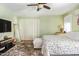 Cozy bedroom with soft carpeting, a full-length mirror, and soft, filtered sunlight at 518 S 114Th Ave, Avondale, AZ 85323