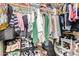 Organized walk-in closet filled with clothing, shoes, and accessories at 518 S 114Th Ave, Avondale, AZ 85323