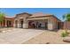 Charming single-story home with xeriscaped yard, covered porch, and convenient drive-through garage at 518 S 114Th Ave, Avondale, AZ 85323