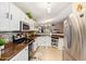 Well-lit kitchen showcasing stainless steel appliances, ample counter space, and tiled flooring at 518 S 114Th Ave, Avondale, AZ 85323