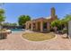 Inviting backyard featuring a covered patio, swimming pool, and low-maintenance landscaping at 5330 W Folley W St, Chandler, AZ 85226