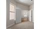 Bright bedroom with carpet flooring and an open doorway with a view to the outside at 5330 W Folley W St, Chandler, AZ 85226