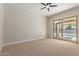 Spacious bedroom with carpet and sliding glass doors leading to the pool area at 5330 W Folley W St, Chandler, AZ 85226