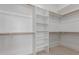 Walk-in closet with shelving and hanging rods for optimal storage at 5330 W Folley W St, Chandler, AZ 85226