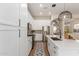 Well-lit kitchen with white cabinets, stainless steel appliances, and a long island at 5330 W Folley W St, Chandler, AZ 85226