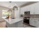 Modern kitchen with white cabinetry, a large island, and updated appliances at 5330 W Folley W St, Chandler, AZ 85226