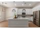 Contemporary kitchen featuring white cabinets, an island, and stainless steel appliances at 5330 W Folley W St, Chandler, AZ 85226