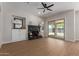 Light-filled living room with a fan, fireplace, and sliding glass door offering outdoor views at 5330 W Folley W St, Chandler, AZ 85226