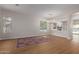 Spacious living room with hard flooring, large windows, and contemporary lighting at 5330 W Folley W St, Chandler, AZ 85226
