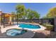 Serene backyard pool and spa surrounded by desert landscape, perfect for relaxing outdoors at 5330 W Folley W St, Chandler, AZ 85226