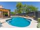 Backyard swimming pool and lounging area, complete with privacy fence and mature trees at 5330 W Folley W St, Chandler, AZ 85226
