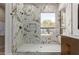 Shower with marble tile surround, niche and window at 5330 W Folley W St, Chandler, AZ 85226