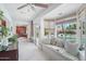 A light filled sun room with a cushioned bench with view of the swimming pool at 5410 E Poinsettia Dr, Scottsdale, AZ 85254
