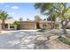 Charming single-story home featuring desert landscaping and a tile roof at 5450 E Paradise Ln, Scottsdale, AZ 85254