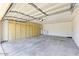 Spacious garage with ample storage cabinets and a utility sink for convenience at 5450 E Paradise Ln, Scottsdale, AZ 85254