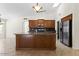 Kitchen with granite island and stainless steel appliances at 5450 E Paradise Ln, Scottsdale, AZ 85254