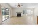 Spacious living room with a fireplace and sliding doors to backyard at 5450 E Paradise Ln, Scottsdale, AZ 85254